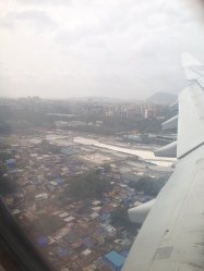 Photo lapse: The main city of Mumbai, then the slums as we approach the airport, then (it is difficult to see but) the slums immediately on the other side of the airport fence.