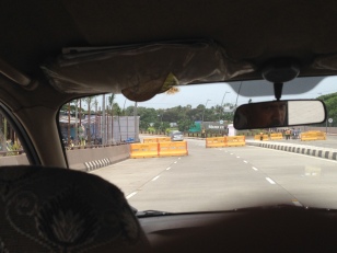 Traffic barriers our taxi speedily traversed to enter the highway