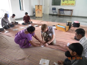 Making paper bags on the first day of the camp - we wanted some way to distract the men from the thought of drinking.