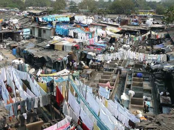 The gigantic outdoor laundry area in Mumbai called Dhobi Ghat - people spend their entire days beating clothing here. (travelblog.org)